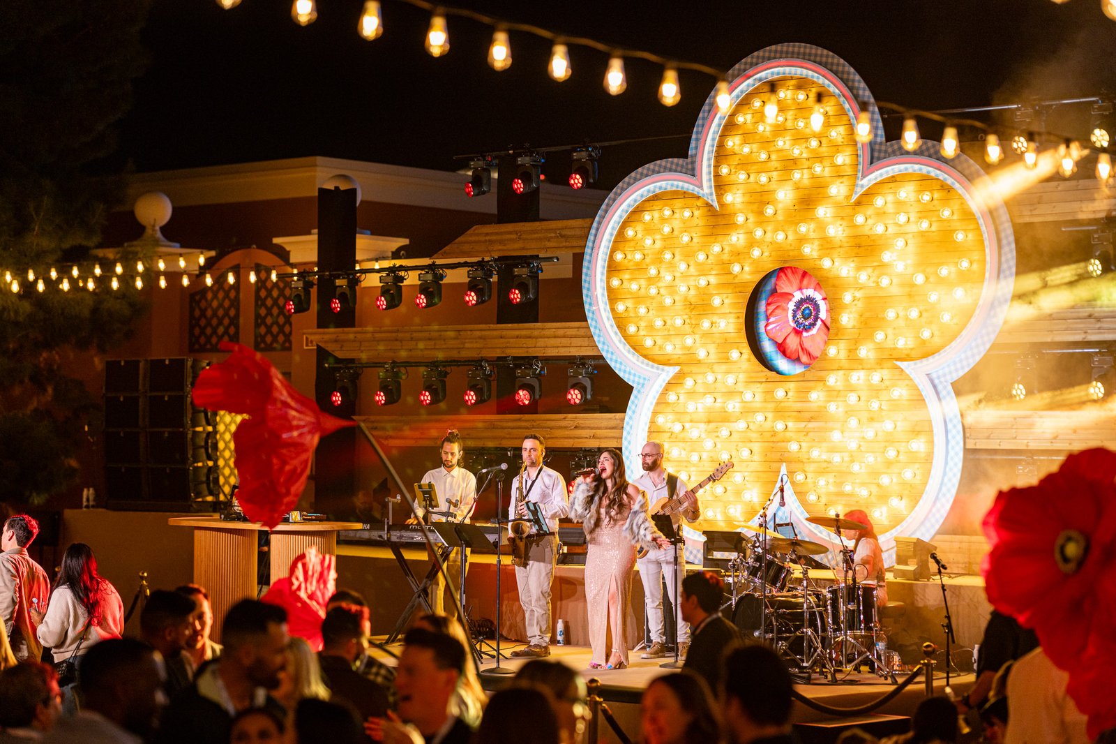 Live band performing on stage as guests fill the dance floor at an evening celebration